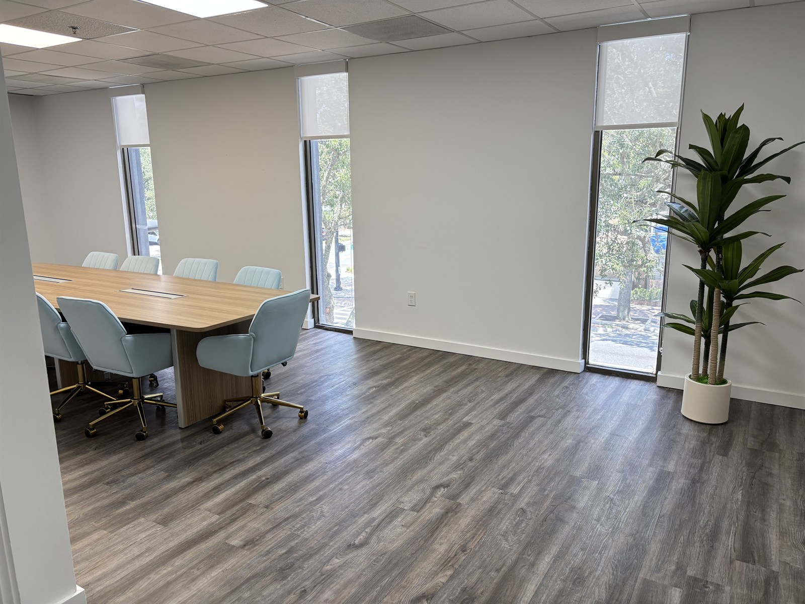 Conference room at the Greet Health Gainesville office with tall windows overlooking downtown